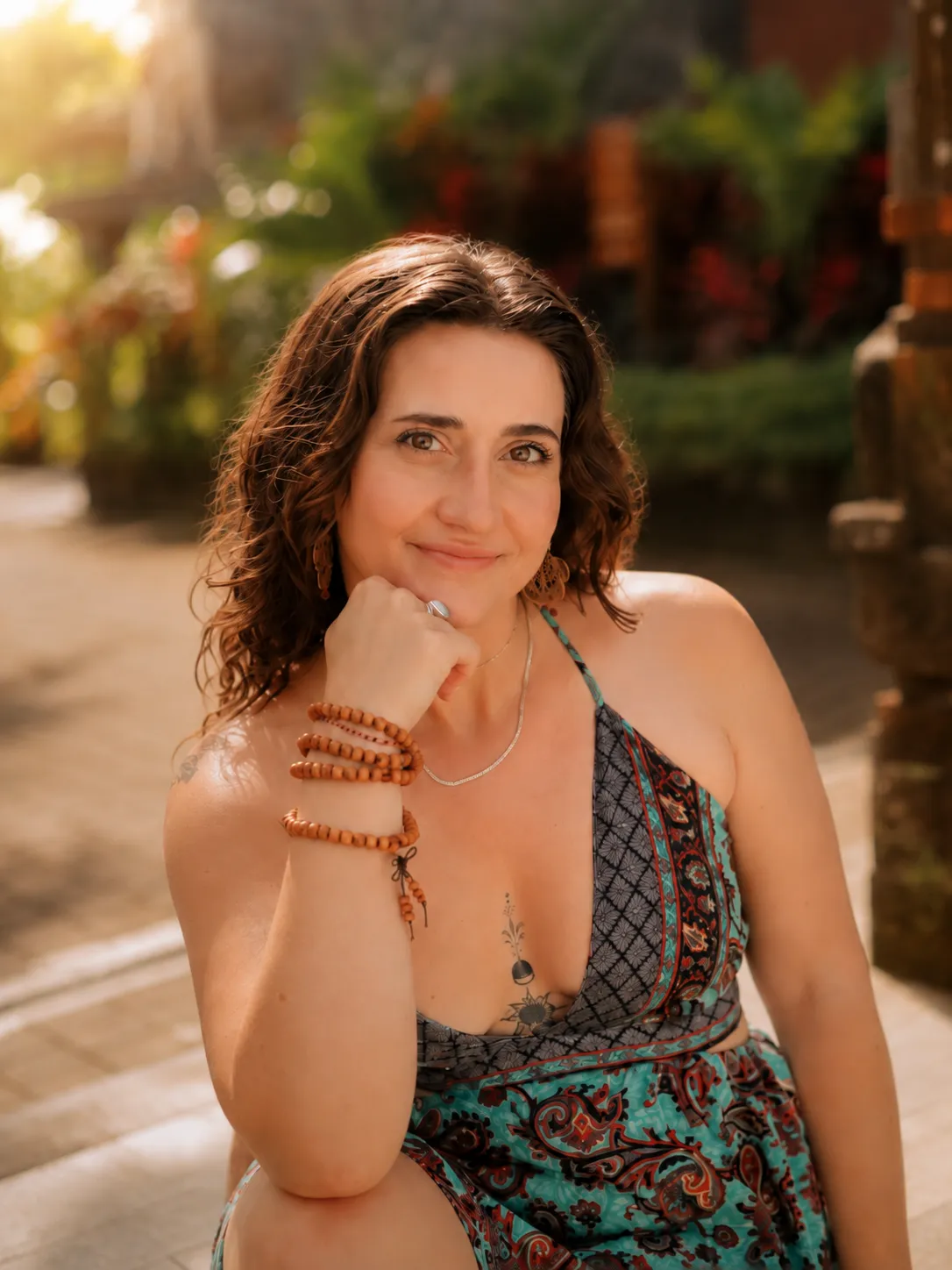 Morgan Storm smiling, chin resting on her hand, golden hour light